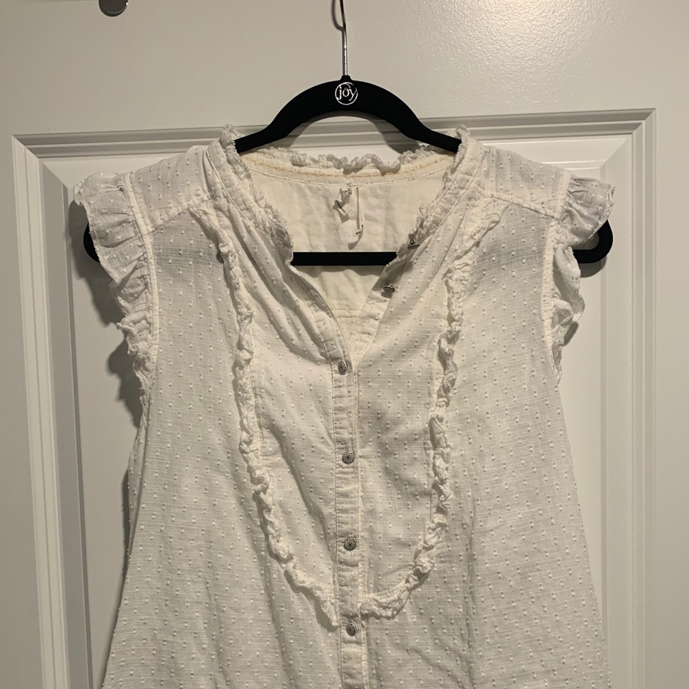 White ruffle sleeveless blouse
